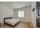 A simple bedroom with a bed, window, and minimal decor. Perfect for relaxation at 9845 E Thistle Ave, Mesa, AZ 85212