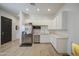 Bright kitchen with white cabinets and stainless steel appliances at 9845 E Thistle Ave, Mesa, AZ 85212