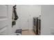 A neutral colored laundry room with modern washer and dryer units and ample storage space at 9845 E Thistle Ave, Mesa, AZ 85212