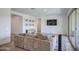 Inviting living room with a large sofa, hardwood floors, and plenty of natural light at 9845 E Thistle Ave, Mesa, AZ 85212