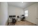 Bright office space with hardwood floors, dual desks and chairs for remote work or studying at 9845 E Thistle Ave, Mesa, AZ 85212