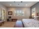 This primary bedroom offers plantation shutters and a decorative accent wall at 10207 W Hedge Hog Pl, Peoria, AZ 85383