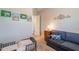 Cozy bedroom featuring stylish decor, a comfortable sofa, and a delightful bed at 10207 W Hedge Hog Pl, Peoria, AZ 85383