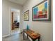Hallway with desk visible and decorative art hanging on the walls at 10207 W Hedge Hog Pl, Peoria, AZ 85383