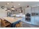 Bright kitchen with stainless steel appliances, large island, light gray cabinets, and pendant lighting at 10207 W Hedge Hog Pl, Peoria, AZ 85383