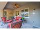Inviting covered patio features comfortable seating and a ceiling fan for outdoor relaxation at 10207 W Hedge Hog Pl, Peoria, AZ 85383