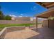 Lawn and patio with a view of the backyard, offering a serene and private outdoor space at 10318 E Michigan Ave, Sun Lakes, AZ 85248