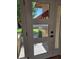 Close-up on a modern front door with glass panels offering an outside view at 10318 E Michigan Ave, Sun Lakes, AZ 85248