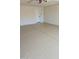 An empty painted garage space with a door and garage door opener at 10318 E Michigan Ave, Sun Lakes, AZ 85248