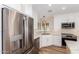 Updated kitchen features stainless steel appliances, white cabinetry, stylish backsplash and modern fixtures at 10318 E Michigan Ave, Sun Lakes, AZ 85248