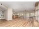 Open floor plan: living room flows into a kitchen with stainless steel appliances and ample counter space at 10318 E Michigan Ave, Sun Lakes, AZ 85248