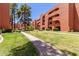 Well-maintained exterior buildings with beautifully landscaped grounds and pedestrian walkway at 12222 N Paradise Village S Pkwy # 237, Phoenix, AZ 85032