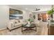 Inviting living room features modern decor, neutral tones, and access to an outdoor patio at 12222 N Paradise Village S Pkwy # 237, Phoenix, AZ 85032