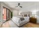 Comfortable main bedroom showcasing stylish decor, natural light, and patio access at 12222 N Paradise Village S Pkwy # 237, Phoenix, AZ 85032