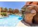A pristine pool features rock waterfalls and stone landscaping, providing a resort-like experience perfect for recreation and relaxation at 12222 N Paradise Village S Pkwy # 237, Phoenix, AZ 85032