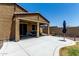 Charming backyard features a covered patio, manicured lawn, and space for outdoor living at 128 S 200Th Ave, Buckeye, AZ 85326
