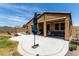 Beautiful backyard with a covered patio, lush green lawn, and well-maintained landscaping for outdoor enjoyment at 128 S 200Th Ave, Buckeye, AZ 85326