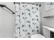 Bathroom with a shower curtain, coordinating rod and stylish nautical themed design at 128 S 200Th Ave, Buckeye, AZ 85326