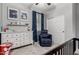 Bedroom features a dresser, a comfortable chair, and decoratively themed wall hangings at 128 S 200Th Ave, Buckeye, AZ 85326