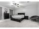 The well-lit main bedroom includes black furniture and a spacious layout at 128 S 200Th Ave, Buckeye, AZ 85326