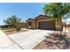 Charming single-story home featuring a desert-landscaped front yard and a two-car garage at 128 S 200Th Ave, Buckeye, AZ 85326