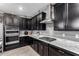 Modern kitchen featuring a cooktop, built-in oven, stainless steel appliances, and elegant marble countertops at 128 S 200Th Ave, Buckeye, AZ 85326