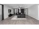 Open-concept living room with tile floors, a ceiling fan, and a sliding glass door at 128 S 200Th Ave, Buckeye, AZ 85326