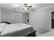 Spacious main bedroom features a ceiling fan and neutral decor creating a serene retreat at 128 S 200Th Ave, Buckeye, AZ 85326