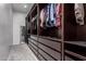 Expansive walk-in closet has custom shelves, drawers, and ample storage space at 128 S 200Th Ave, Buckeye, AZ 85326