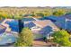 Aerial view of home showcasing tile roof, landscaping, and neighborhood views at 13719 W Amberwing St, Peoria, AZ 85383