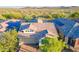 Aerial view of homes with solar panels showcasing the neighborhood's modern energy solutions at 13719 W Amberwing St, Peoria, AZ 85383