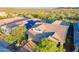 Scenic aerial view highlights the home's prime location, tile roof, and desert surroundings at 13719 W Amberwing St, Peoria, AZ 85383