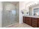 Beautiful bathroom with a glass shower and double sink vanity at 13719 W Amberwing St, Peoria, AZ 85383