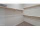 Walk-in closet with ample shelving and rod space for storage at 13719 W Amberwing St, Peoria, AZ 85383