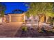 Charming single-Gathering home with a well-manicured front yard, a two-car garage, and a welcoming entrance at 13719 W Amberwing St, Peoria, AZ 85383