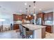Well-appointed kitchen with a center island and bar seating at 13719 W Amberwing St, Peoria, AZ 85383