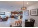Open-concept layout connecting the living room and kitchen areas, with stylish décor and natural light at 13719 W Amberwing St, Peoria, AZ 85383