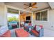 Inviting outdoor seating area with stylish furniture, perfect for relaxing by the pool at 13719 W Amberwing St, Peoria, AZ 85383