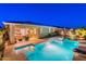 Beautifully lit backyard pool and spa provides ultimate relaxation and outdoor enjoyment at 13719 W Amberwing St, Peoria, AZ 85383