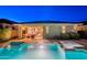 Beautiful backyard with a pristine pool, a relaxing spa, and a covered outdoor seating area for ultimate relaxation at 13719 W Amberwing St, Peoria, AZ 85383