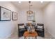 Cozy sitting area with two armchairs, artwork, and a stylish chandelier at 13719 W Amberwing St, Peoria, AZ 85383