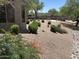 Lush backyard with desert landscaping, offering a serene outdoor escape for relaxation and enjoyment at 14000 N 94Th St # 1077, Scottsdale, AZ 85260