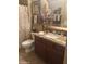 Cozy bathroom featuring a shower with curtain, toilet, vanity and granite countertop at 14000 N 94Th St # 1077, Scottsdale, AZ 85260