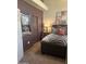 Cozy bedroom featuring a modern bed with zebra-patterned bedding and a decorative mirror at 14000 N 94Th St # 1077, Scottsdale, AZ 85260