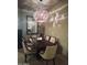 Elegant dining room with stylish chandelier lighting and seating for six at 14000 N 94Th St # 1077, Scottsdale, AZ 85260