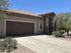 Charming single-story home with a well-maintained front yard and attached two-car garage at 14000 N 94Th St # 1077, Scottsdale, AZ 85260
