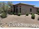 Well-maintained home with desert landscaping, presenting a clean and attractive exterior at 14000 N 94Th St # 1077, Scottsdale, AZ 85260