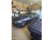 Spacious garage showcasing a sleek dark-colored sedan, perfect for car enthusiasts and storage at 14000 N 94Th St # 1077, Scottsdale, AZ 85260
