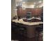 Gourmet kitchen featuring granite countertops, breakfast bar, and stainless steel appliances at 14000 N 94Th St # 1077, Scottsdale, AZ 85260