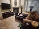 Comfortable living room with a fireplace, sleek TV, and ample seating, providing a warm and welcoming atmosphere at 14000 N 94Th St # 1077, Scottsdale, AZ 85260